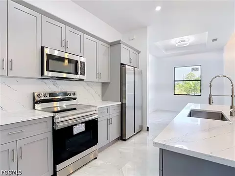Kitchen - 105 Ruby Ave N, Lehigh Acres, FL 33971 photo 5 of 7