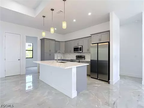 Kitchen - 105 Ruby Ave N, Lehigh Acres, FL 33971 photo 1 of 7