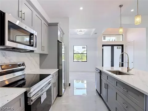 Kitchen - 105 Ruby Ave N, Lehigh Acres, FL 33971 photo 4 of 7