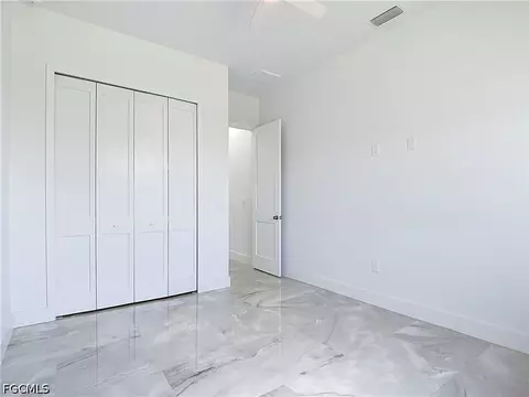 Bedroom - 105 Ruby Ave N, Lehigh Acres, FL 33971 photo 7 of 9