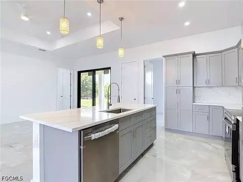 Kitchen - 105 Ruby Ave N, Lehigh Acres, FL 33971 photo 2 of 7
