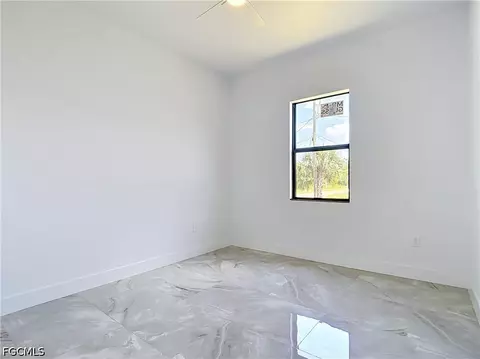 Bedroom - 105 Ruby Ave N, Lehigh Acres, FL 33971 photo 8 of 9