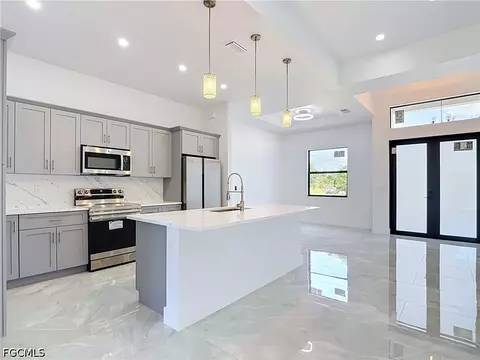 Kitchen - 105 Ruby Ave N, Lehigh Acres, FL 33971 photo 6 of 7