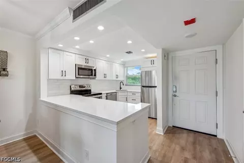 Kitchen - 37 High Point Cir E #208, Naples, FL 34103 photo 3 of 3