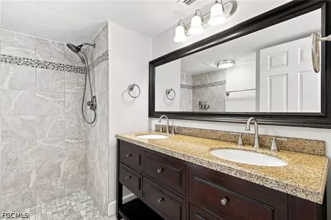 Bath - 136 Cypress Way E #4, Naples, FL 34110 photo 1 of 2