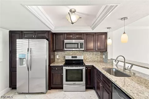 Kitchen - 136 Cypress Way E #4, Naples, FL 34110 photo 2 of 3