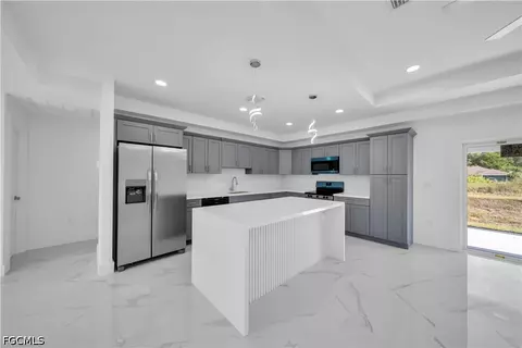 Kitchen - 1021 Pilgrim St E, Lehigh Acres, FL 33974 photo 1 of 5