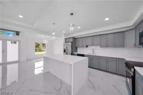 Kitchen - 1021 Pilgrim St E, Lehigh Acres, FL 33974 photo 3 of 5