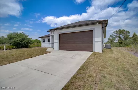 Exterior - 3218 28th St SW, Lehigh Acres, FL 33976 photo 3 of 8