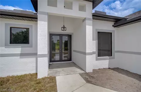 Exterior - 3218 28th St SW, Lehigh Acres, FL 33976 photo 4 of 8
