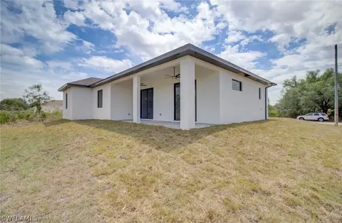 Exterior - 3218 28th St SW, Lehigh Acres, FL 33976 photo 6 of 8