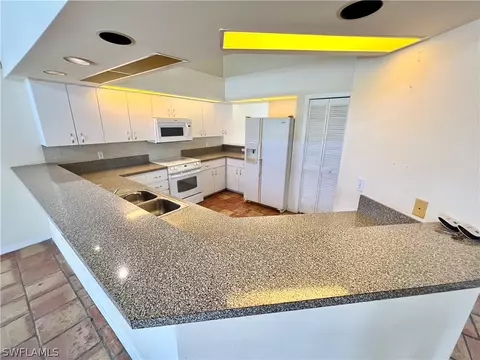 Kitchen - 717 Bently St E, Lehigh Acres, FL 33974 photo 2 of 5