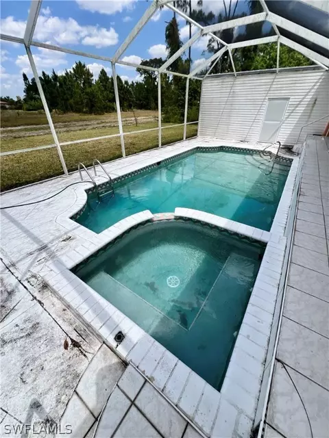 Exterior - 717 Bently St E, Lehigh Acres, FL 33974 photo 4 of 8