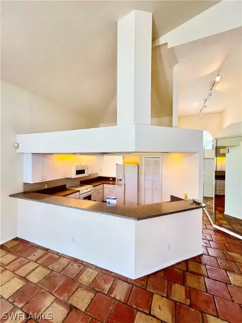 Kitchen - 717 Bently St E, Lehigh Acres, FL 33974 photo 1 of 5