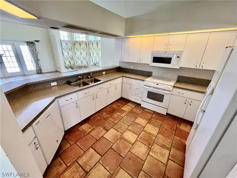 Kitchen - 717 Bently St E, Lehigh Acres, FL 33974 photo 4 of 5