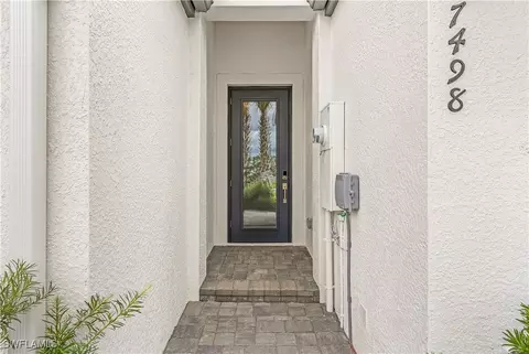 7498 Rockefeller Dr, Naples, FL 34119 photo 2