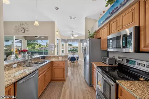 Kitchen - 20940 Persimmon Pl, Estero, FL 33928 photo 1 of 4