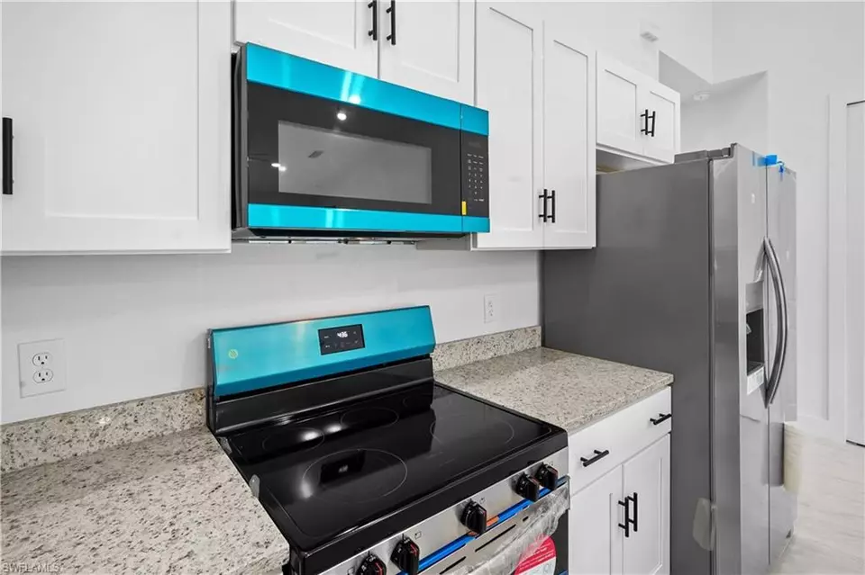 Kitchen - 360362 Grant Blvd, Lehigh Acres, FL 33974 photo 3 of 4