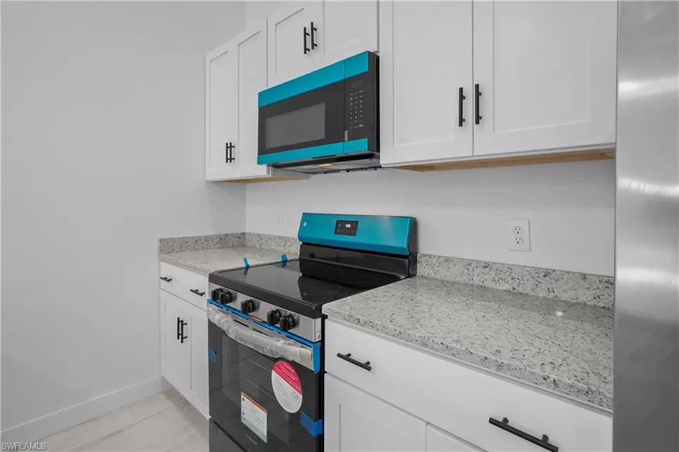 Kitchen - 360362 Grant Blvd, Lehigh Acres, FL 33974 photo 2 of 4