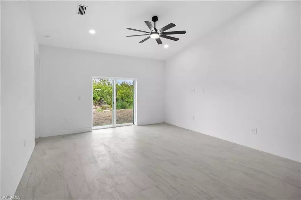 Living - 360362 Grant Blvd, Lehigh Acres, FL 33974 photo 3 of 4