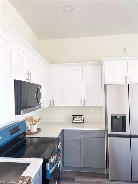 Kitchen - 411 Eisenhower Blvd, Lehigh Acres, FL 33974 photo 2 of 3