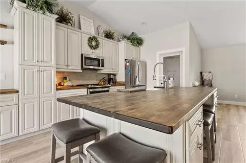 Kitchen - 655 Trinity St E, Lehigh Acres, FL 33974 photo 3 of 4