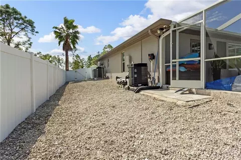 Exterior - 655 Trinity St E, Lehigh Acres, FL 33974 photo 9 of 20