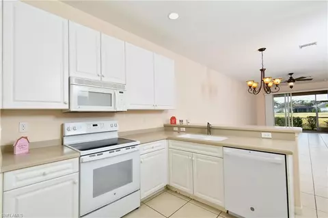 Kitchen - 4808 Fairloop Run, Lehigh Acres, FL 33973 photo 3 of 4