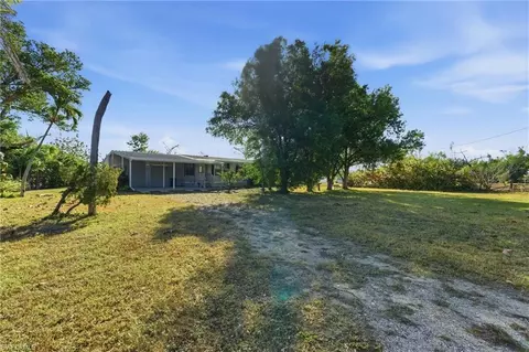 Exterior - 11250 Stringfellow Rd, Bokeelia, FL 33922 photo 5 of 8