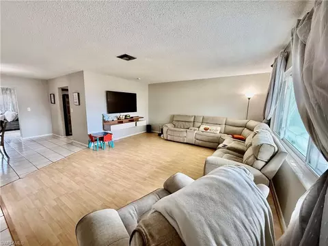 Living - 720 Shadyside St, Lehigh Acres, FL 33936 photo 3 of 4