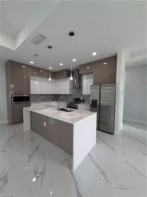 Kitchen - 846 Runble St E, Lehigh Acres, FL 33974 photo 2 of 2