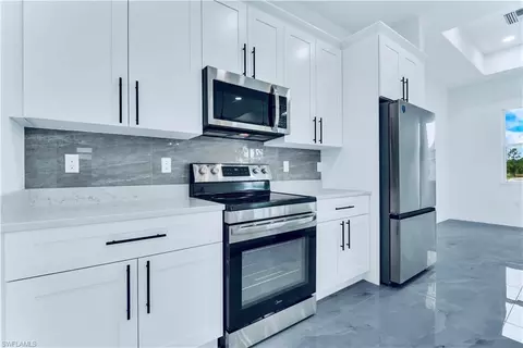 Kitchen - 654 Trinity St E, Lehigh Acres, FL 33974 photo 2 of 3