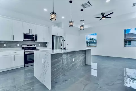 Kitchen - 654 Trinity St E, Lehigh Acres, FL 33974 photo 3 of 3