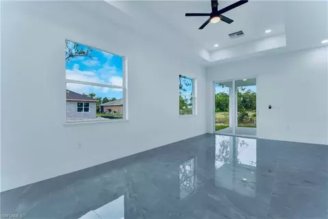Living - 654 Trinity St E, Lehigh Acres, FL 33974 photo 3 of 4