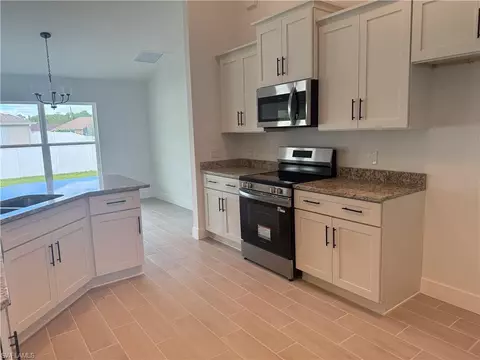 Kitchen - 486 Willowbrook Dr, Lehigh Acres, FL 33972 photo 2 of 3