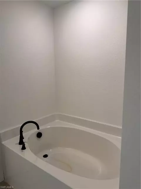 Bath - 486 Willowbrook Dr, Lehigh Acres, FL 33972 photo 1 of 6