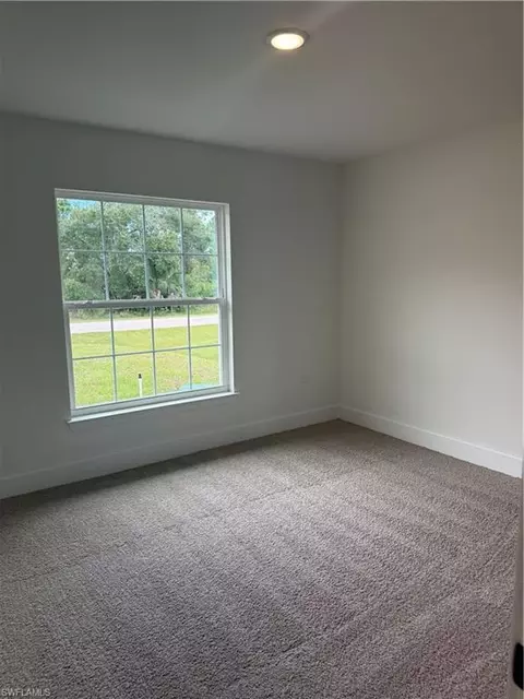 Bedroom - 486 Willowbrook Dr, Lehigh Acres, FL 33972 photo 2 of 3