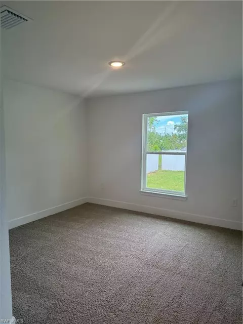 Bedroom - 486 Willowbrook Dr, Lehigh Acres, FL 33972 photo 3 of 3