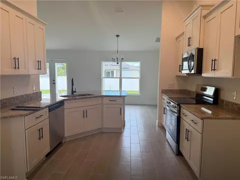 Kitchen - 486 Willowbrook Dr, Lehigh Acres, FL 33972 photo 3 of 3