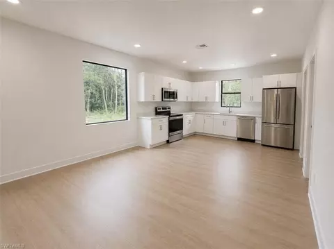 Living - 666 Topeka Ct, Lehigh Acres, FL 33972 photo 2 of 2