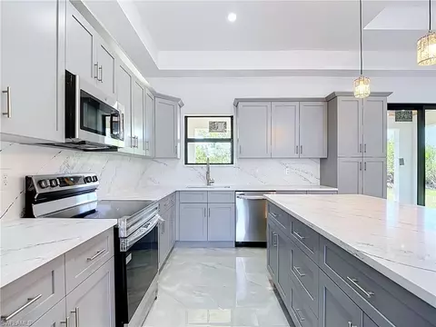 Kitchen - 103 Ruby Ave N, Lehigh Acres, FL 33971 photo 4 of 6