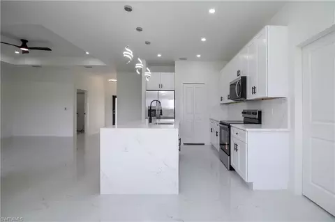 Kitchen - 943 Commodore St, Lehigh Acres, FL 33974 photo 2 of 2