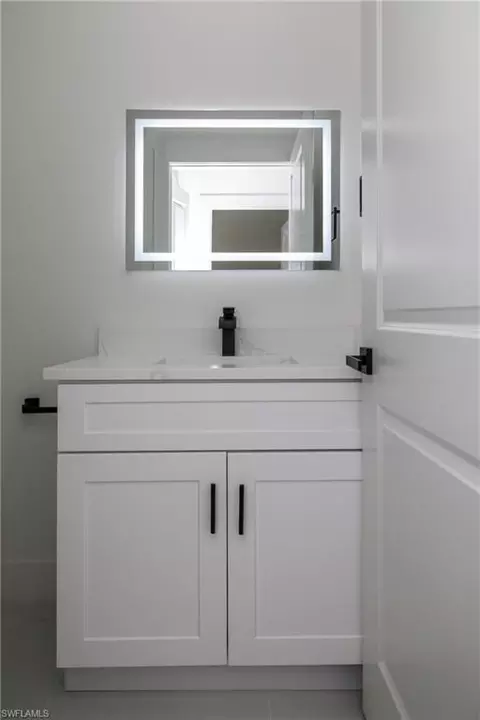 Bath - 943 Commodore St, Lehigh Acres, FL 33974 photo 4 of 5