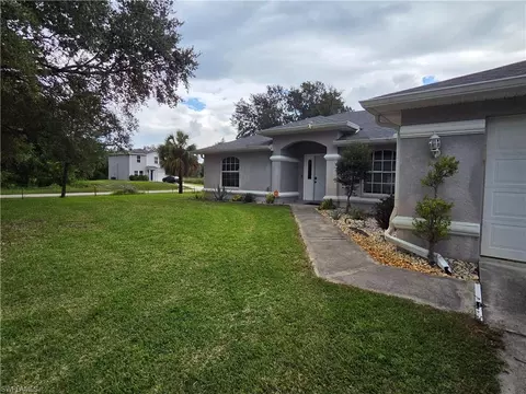 Exterior - 1025 Iris St E, Lehigh Acres, FL 33974 photo 3 of 13