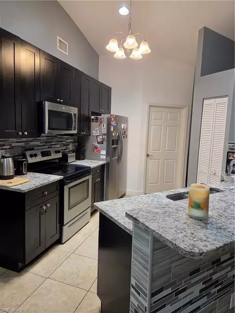 Kitchen - 1025 Iris St E, Lehigh Acres, FL 33974 photo 1 of 4