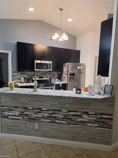 Kitchen - 1025 Iris St E, Lehigh Acres, FL 33974 photo 4 of 4