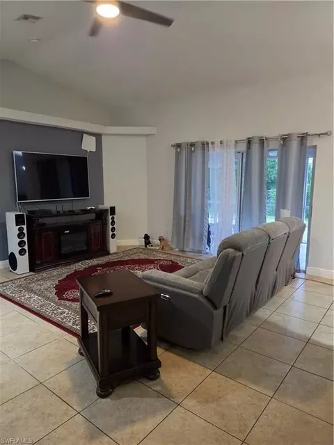 Living - 1025 Iris St E, Lehigh Acres, FL 33974 photo 1 of 2