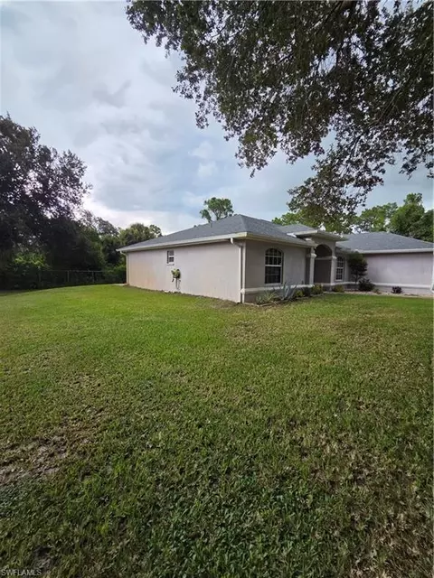 Exterior - 1025 Iris St E, Lehigh Acres, FL 33974 photo 6 of 13