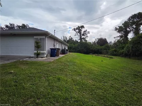 Exterior - 1025 Iris St E, Lehigh Acres, FL 33974 photo 9 of 13