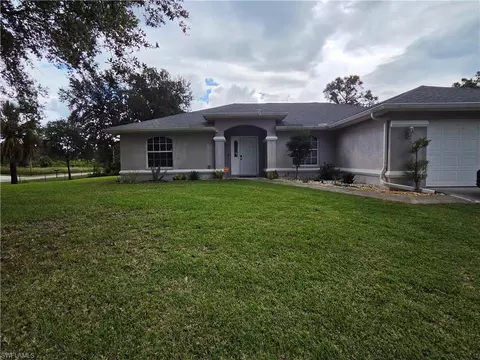 Exterior - 1025 Iris St E, Lehigh Acres, FL 33974 photo 2 of 13